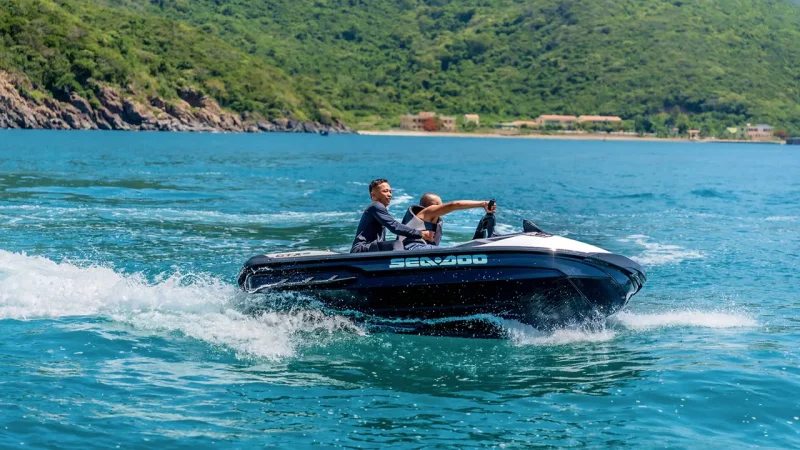 Visitors enjoying water sports during a yacht tour