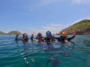 Visitors taking photos on the water before scuba diving at Hon Mot, Nha Trang