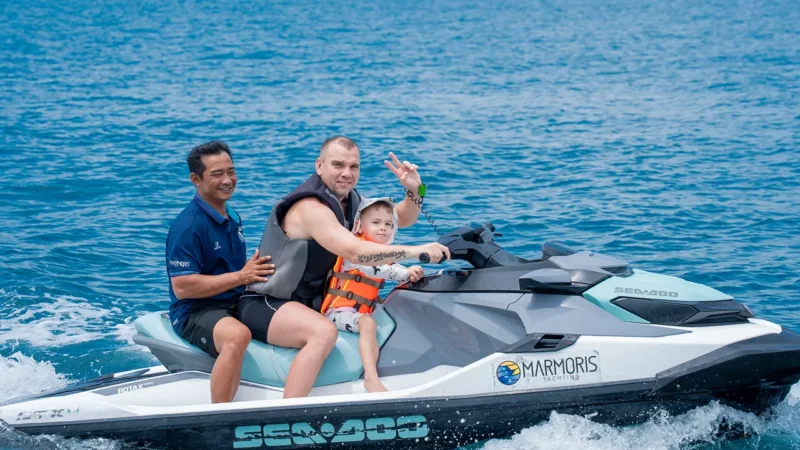 Visitors enjoying water sports during a yacht tour