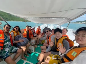 Foreign and Vietnamese travelers enjoying a shared group tour in Nha Trang together