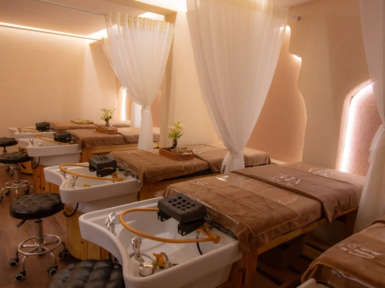Professional hot stone massage spa environment featuring clean treatment spaces