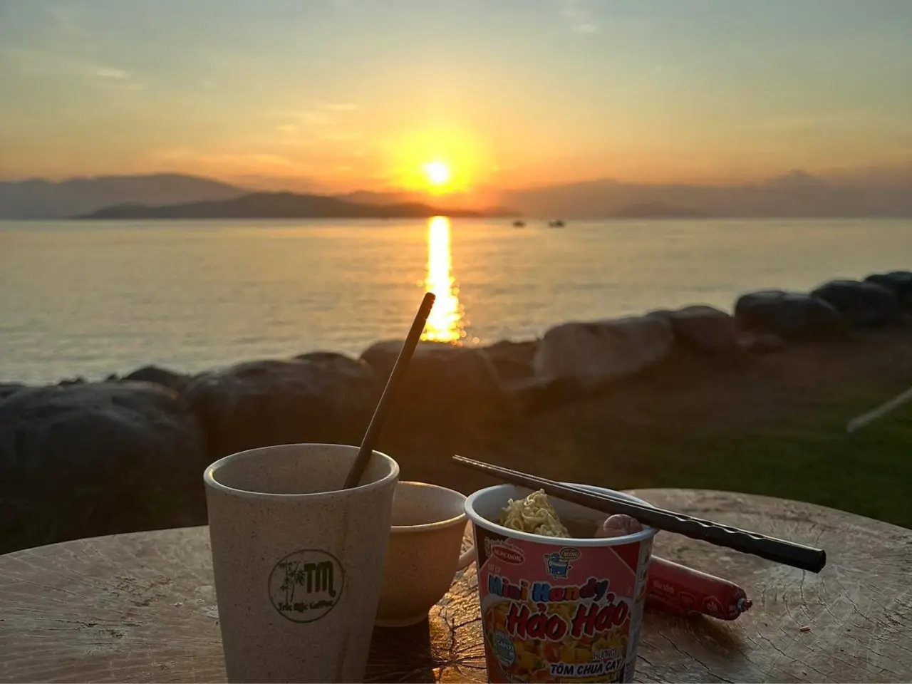 Guests having breakfast by the beach while watching the sunrise at May Camping Guests having breakfast by the beach while watching the sunrise at May Camping